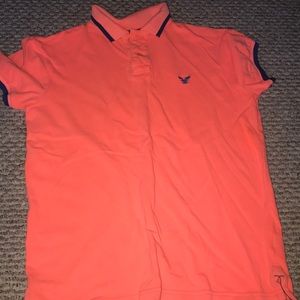 American eagle bright orange and blue polo.